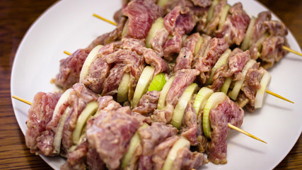 Cooking Meat. Onions And Tomatoes Dance Around The Frying Pan, Then A Plate Of Sliced Meat Appears In The Picture.