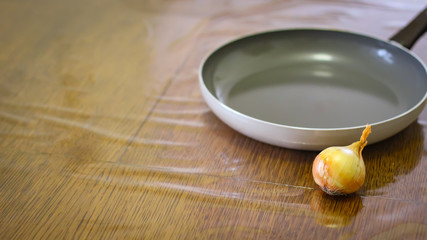 Cooking. Onions And Tomatoes Dance Around The Frying Pan.