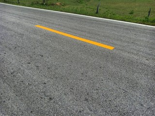 The country road beside is a rice field.