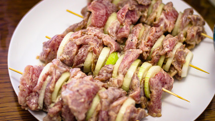 Cooking Meat. Onions And Tomatoes Dance Around The Frying Pan, Then A Plate Of Sliced Meat Appears In The Picture.