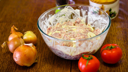 Cooking Meat. Onions And Tomatoes Dance Around The Frying Pan, Then A Plate Of Sliced Meat Appears In The Picture.
