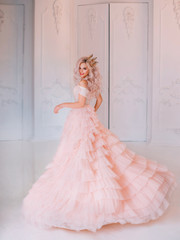 Cheerful beautiful princess girl blonde laugh smiling. Luxury ballroom evening elegant trendy tulle...