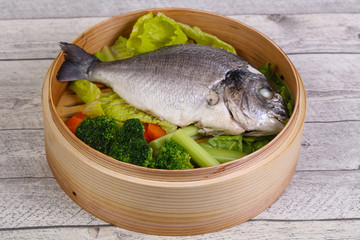 Steamed dorada with vegetables
