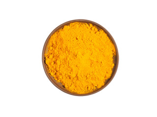 Turmeric (curcuma) powder on brown clay plate isolated on white