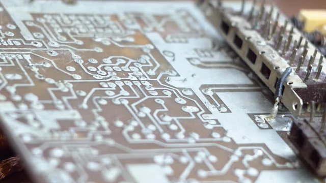 Old, used electrical board. Electric waste. Panoramic view.