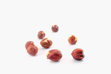 A few hazelnuts isolated on a white background. Well suited for baking or in healthy muesli.