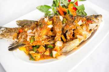 fired sea bass top with thai spicy sauce 