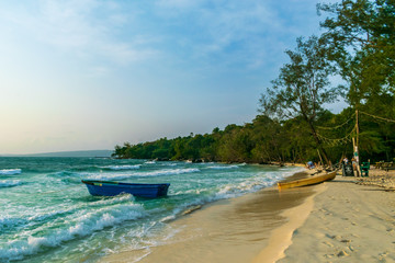 Longset Beach, Koh Rong, Cambodia- Feb, 2020 : a view of some boats and a volleyball net on the...