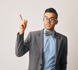 Young smiling man having a good idea