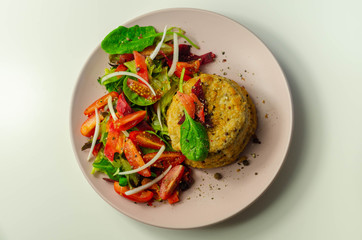 Smoked haddock fishcake with melting cheddar sauce and mixed salad
