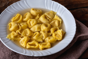 Cappelletti in brodo. Pasta italiana. Ravioli, tortellini