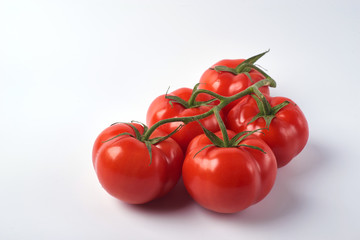 Tomato isolate. Tomato on a white background. Tomatoes top view, side View. With the path cut off.