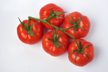 Tomato isolate. Tomato on a white background. Tomatoes top view, side View. With the path cut off.