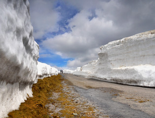 Mountain road snow tunnel on pass