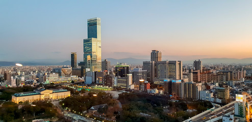 Osaka, Japan, January 18 2019 : Panorama and landscape view of Osaka city on evening and sunset sky background.