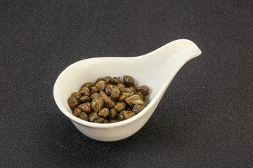 Tasty capers in the bowl