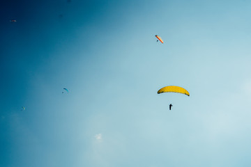 Paragliders in the clear sky