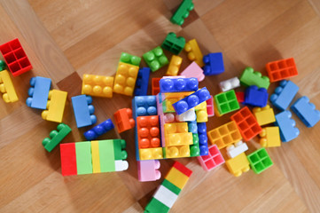 Multi-colored children's designer. scattered across the floor