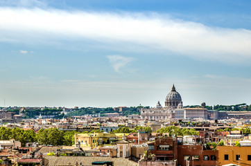 View of the sunlit city and St. Peter's Basilica. Rome. Italy