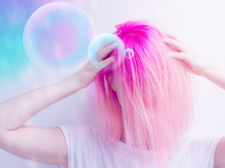 futuristic looking girl with pink hair thinking concept with bubbles