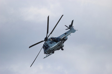 
Military helicopter during the flight - obrazy, fototapety, plakaty