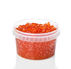 Plastic container with red salmon or keta fish caviar on white background. Sea food