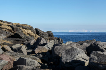 rocky coast of Atlantic ocean in Iceland. Large beautiful stones for the background