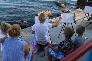 Group of artists on the beach