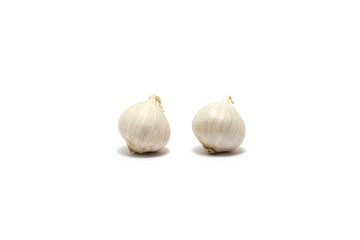 Two solo garlics isolated on white background