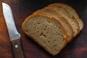 Golden bread slices and knife