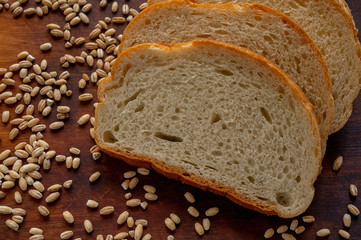 Golden slices of bread and wheat grains