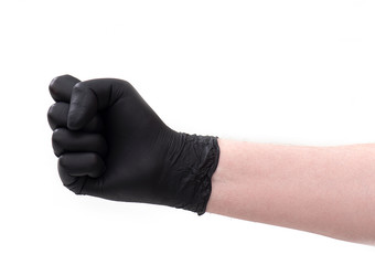 Fist by hand in black latex gloves isolated on white background. 