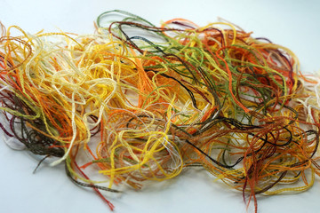 multi-colored pieces of woolen threads in autumn colors