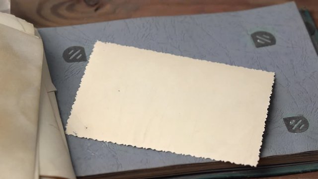 Someone looking at old photo album.