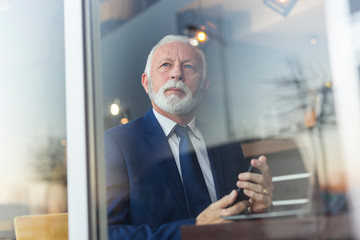 Senior businessman using smart phone