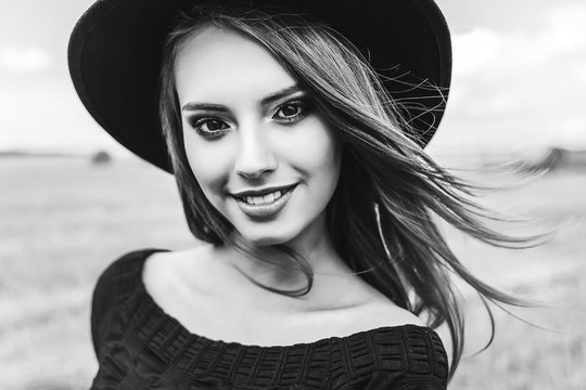 Beautiful woman natural face freckles casual female monochrome portrait lifestyle beauty girl in black hat