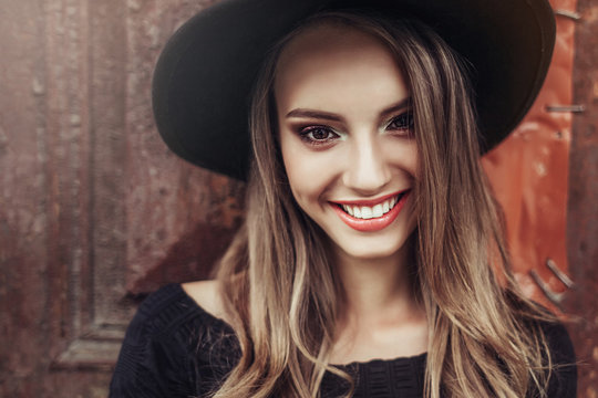 Beautiful happy woman natural face freckles casual female  portrait lifestyle beauty girl in black hat