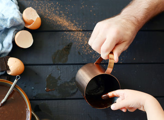 Child with dad and chocolate cake