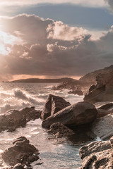 sunset clouds and waves on the island of elba