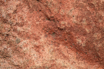 Rock stone for the backdrop. Color - light brown, a shade of red. Cracks, bumps, inclusions.