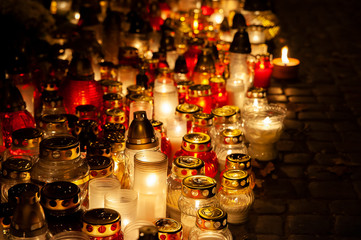 Candles burning at a cemetery. Polish tradition of commemorating deceased loved ones. 'All Saints Day' - November 1st
