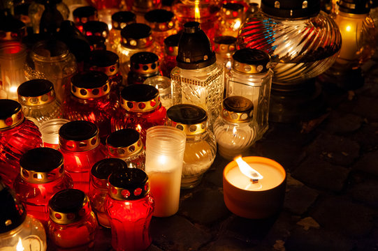 Candles burning at a cemetery. Polish tradition of commemorating deceased loved ones. 'All Saints Day' - November 1st