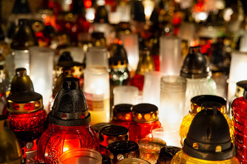 Candles burning at a cemetery. Polish tradition of commemorating deceased loved ones. 'All Saints Day' - November 1st