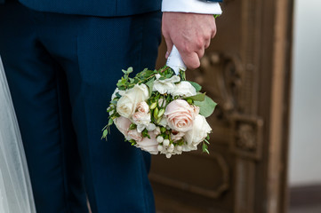 Bouquet of flowers in the mans hand