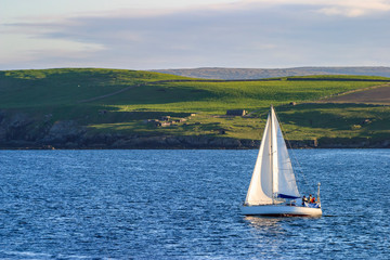 Shetland archipelago with a sailboat