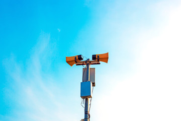 public Horn speakers on blue sky background