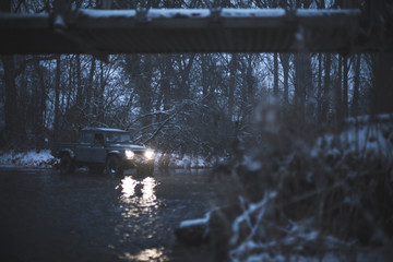 Land rover defender snow river