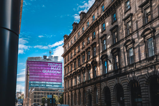 A view of a Glasgow street in front of a tall building