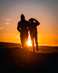 Walker's silhouettes at sunset in the Lake District