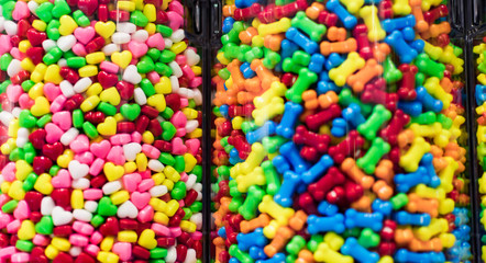 Colorful candies inside a transparent glass jar